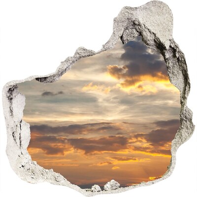 Sunset through a hole in the wall