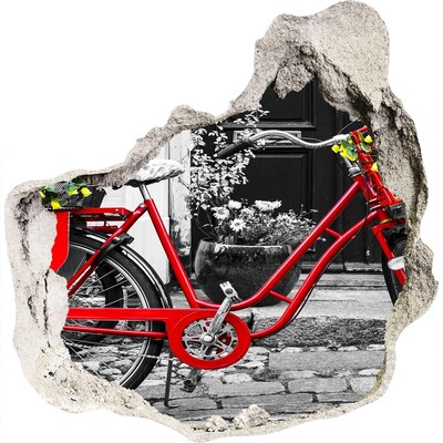 Hole in the wall decal A red bicycle in an urban setting