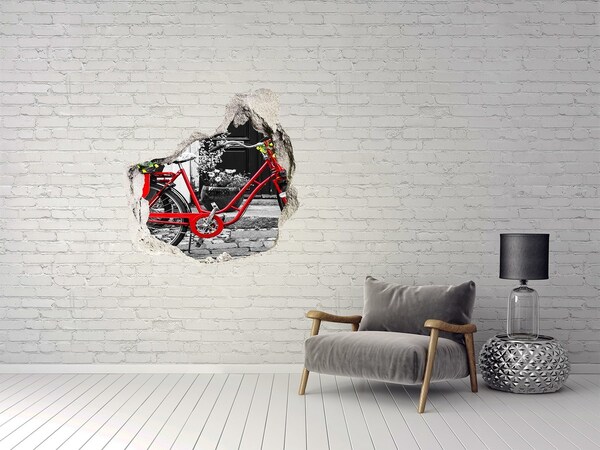 Hole in the wall decal A red bicycle in an urban setting