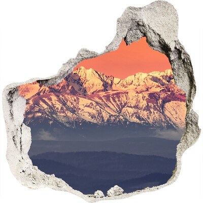 Hole wall sticker Mountains in the glow of sunset