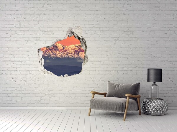 Hole wall sticker Mountains in the glow of sunset
