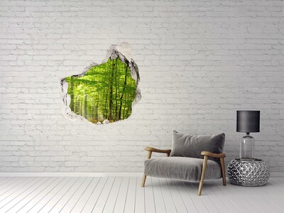 Hole in the wall sticker Green forest in the sunlight