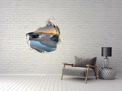 Hole in the wall sticker Sunset over the beach