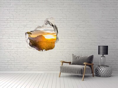 3D wall hole wallpaper Sunset in the mountains