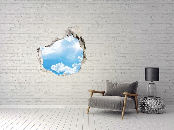 Hole in the wall sticker Blue sky with clouds