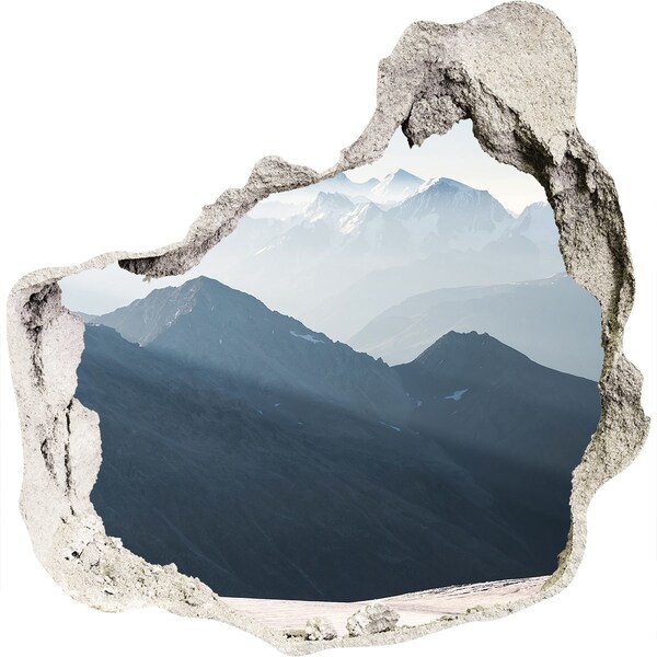 Hole wall sticker Mountain landscape through a hole in the wall