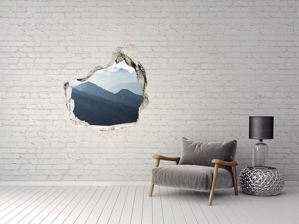 Hole wall sticker Mountain landscape through a hole in the wall