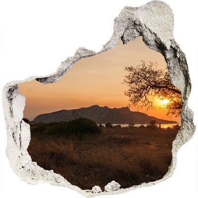 Hole wall sticker Sunset over a mountain landscape