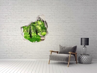 Hole in the wall sticker Green forest in the sunlight