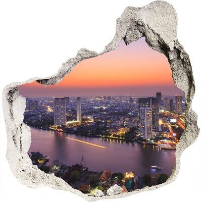 Hole wall sticker View of the city at sunset