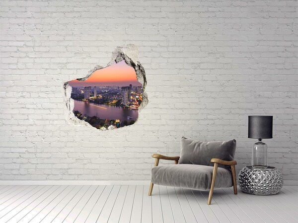 Hole wall sticker View of the city at sunset