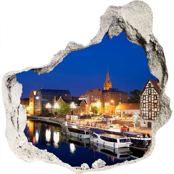 Hole in the wall sticker Night view of the city by the river