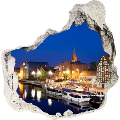Hole in the wall sticker Night view of the city by the river