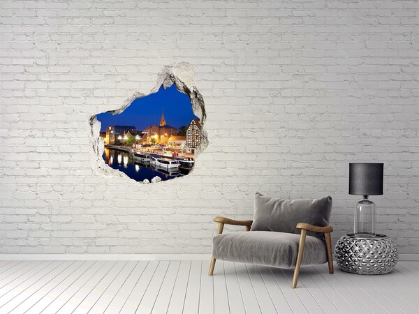 Hole in the wall sticker Night view of the city by the river