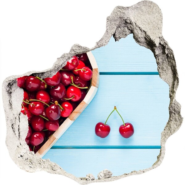 Hole wall sticker Sweet cherries on a blue background