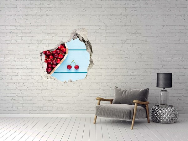 Hole wall sticker Sweet cherries on a blue background