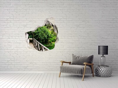 Hole in the wall sticker A green paradise with a wooden bridge