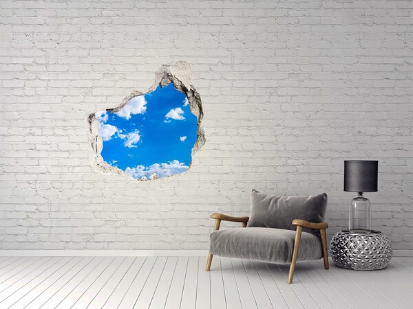Hole in the wall sticker Blue sky with clouds