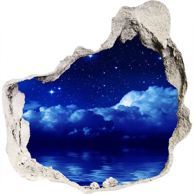 Hole in the wall sticker Night sky over the ocean