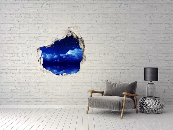 Hole in the wall sticker Night sky over the ocean