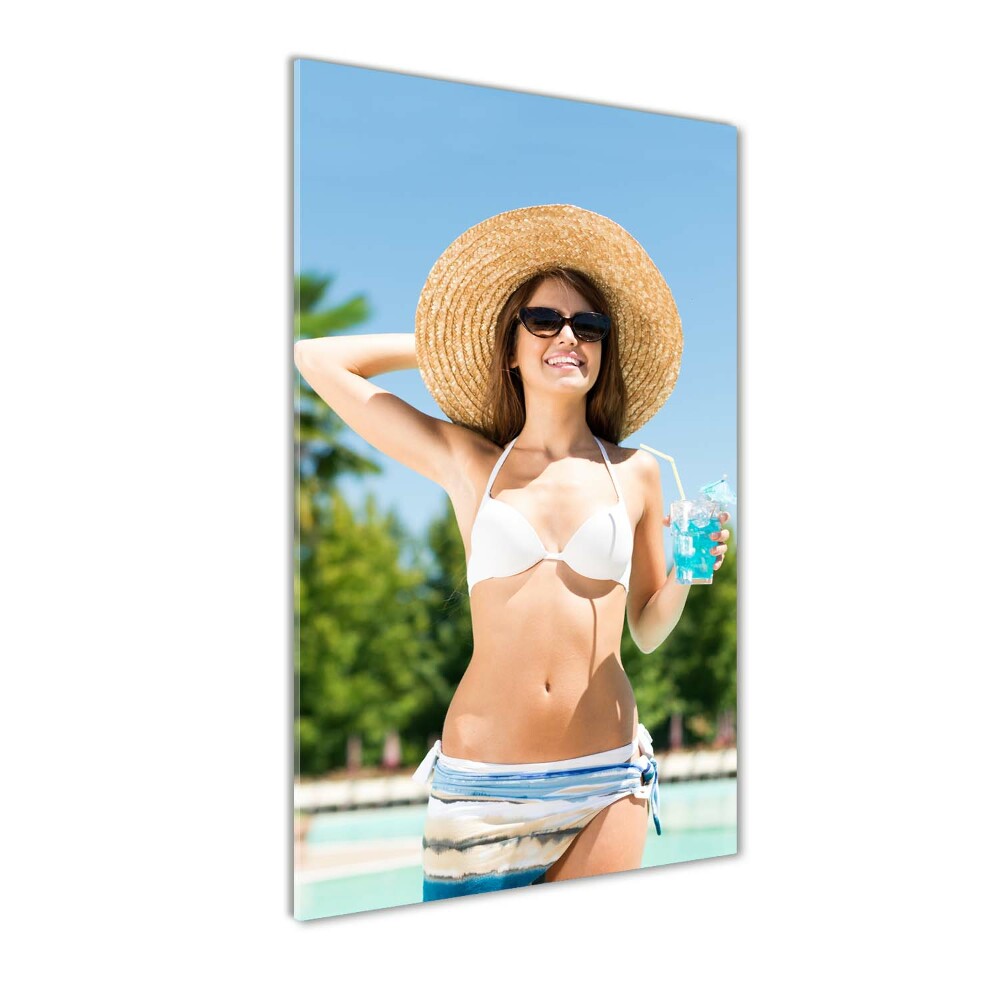 Acrylic glass print A woman over the pool