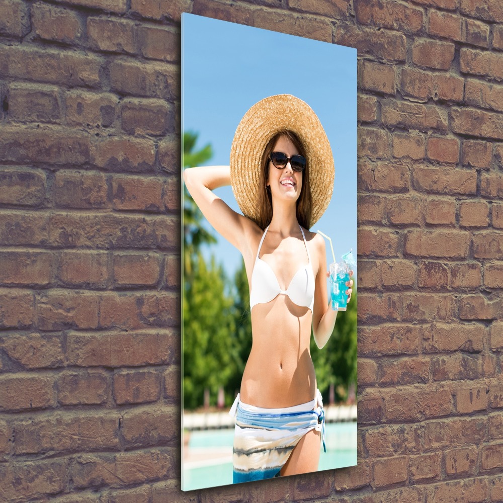 Acrylic glass print A woman over the pool