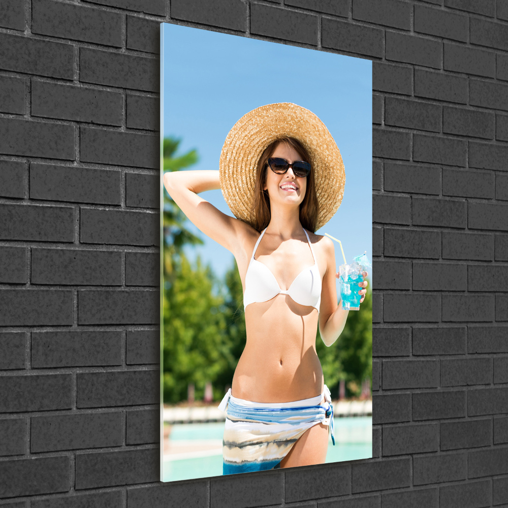 Acrylic glass print A woman over the pool