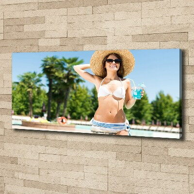 Canvas wall art A woman over the pool