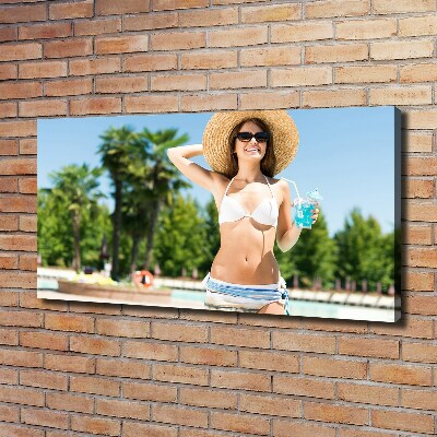 Canvas wall art A woman over the pool