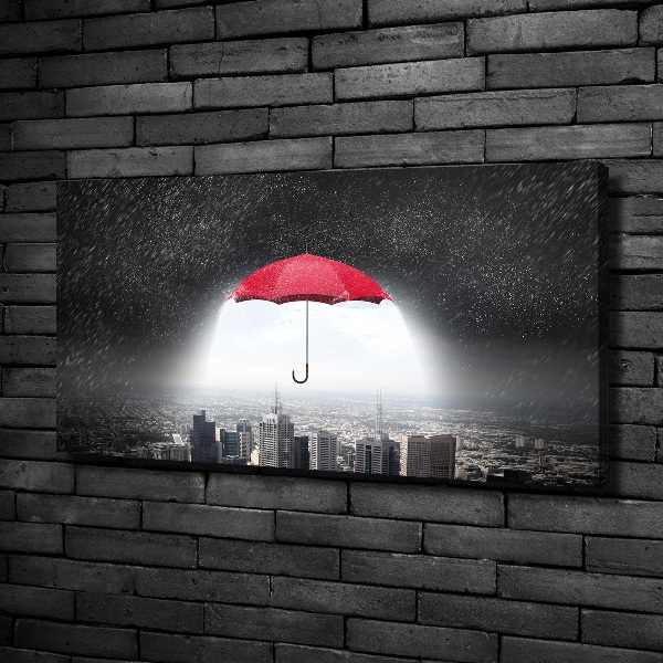 Canvas wall art Umbrella above the city