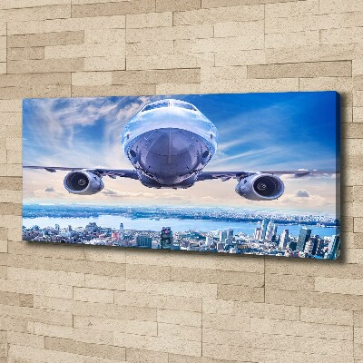 Canvas wall art Aircraft over the city