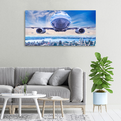 Canvas wall art Aircraft over the city