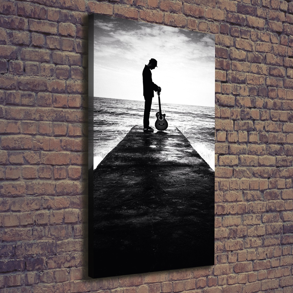 Canvas wall art Guitarist on the pier