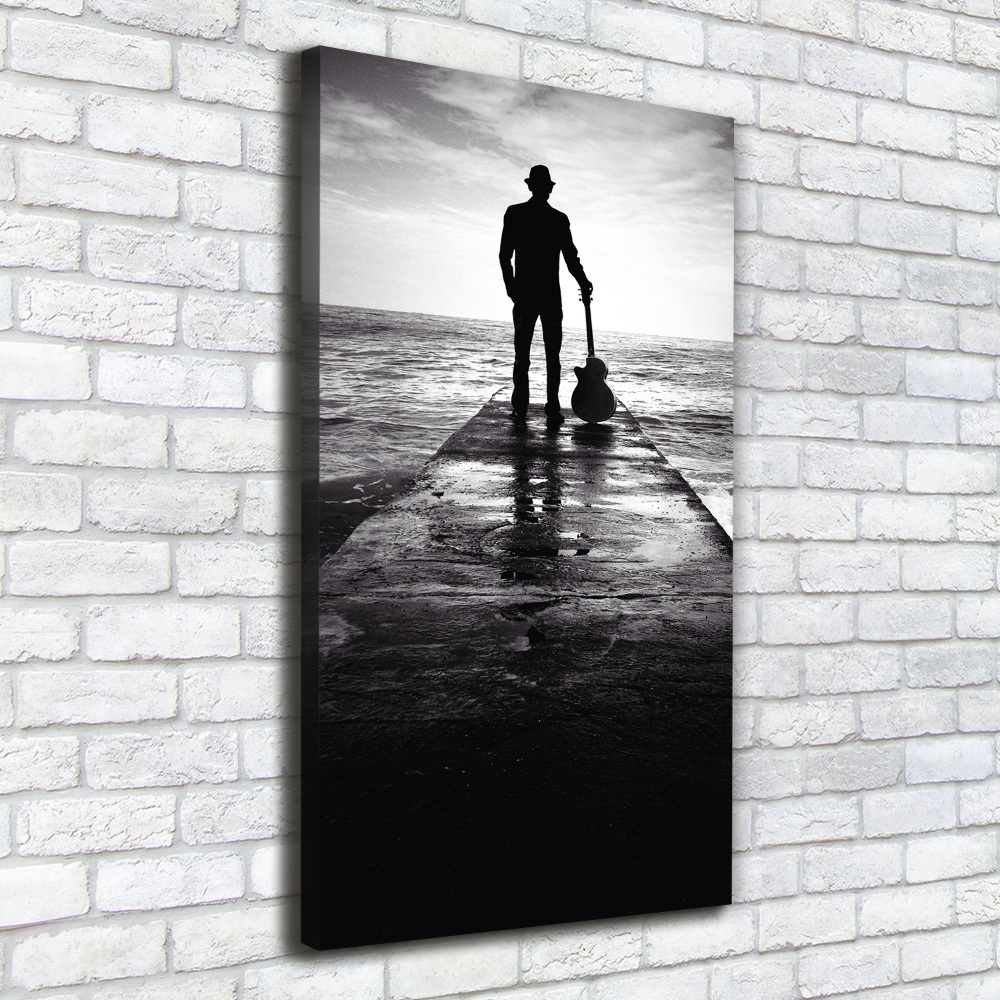 Canvas wall art Guitarist on the pier