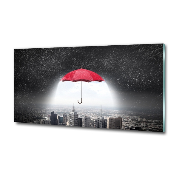 Glass art print Umbrella above the city