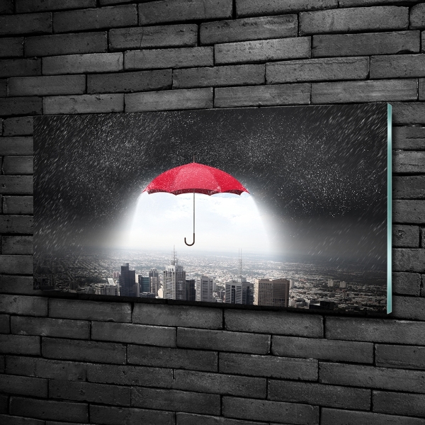 Glass art print Umbrella above the city