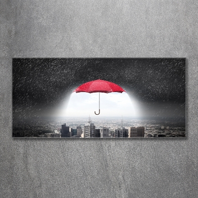 Glass art print Umbrella above the city