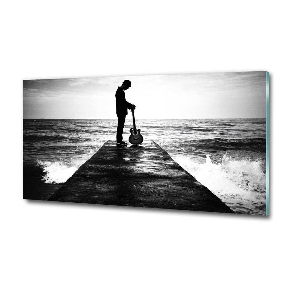 Photo printed on glass Guitarist on the pier