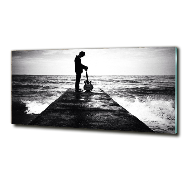 Photo printed on glass Guitarist on the pier