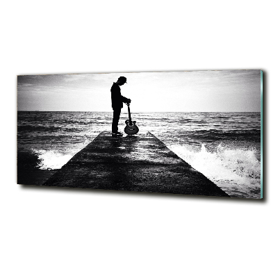 Photo printed on glass Guitarist on the pier