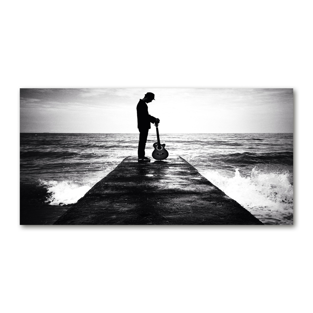 Photo printed on glass Guitarist on the pier