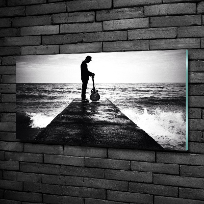 Photo printed on glass Guitarist on the pier