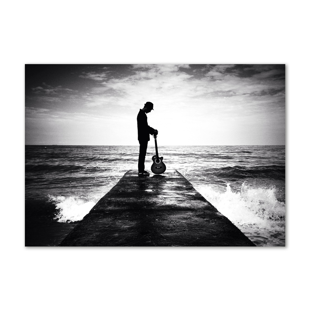 Photo printed on glass Guitarist on the pier