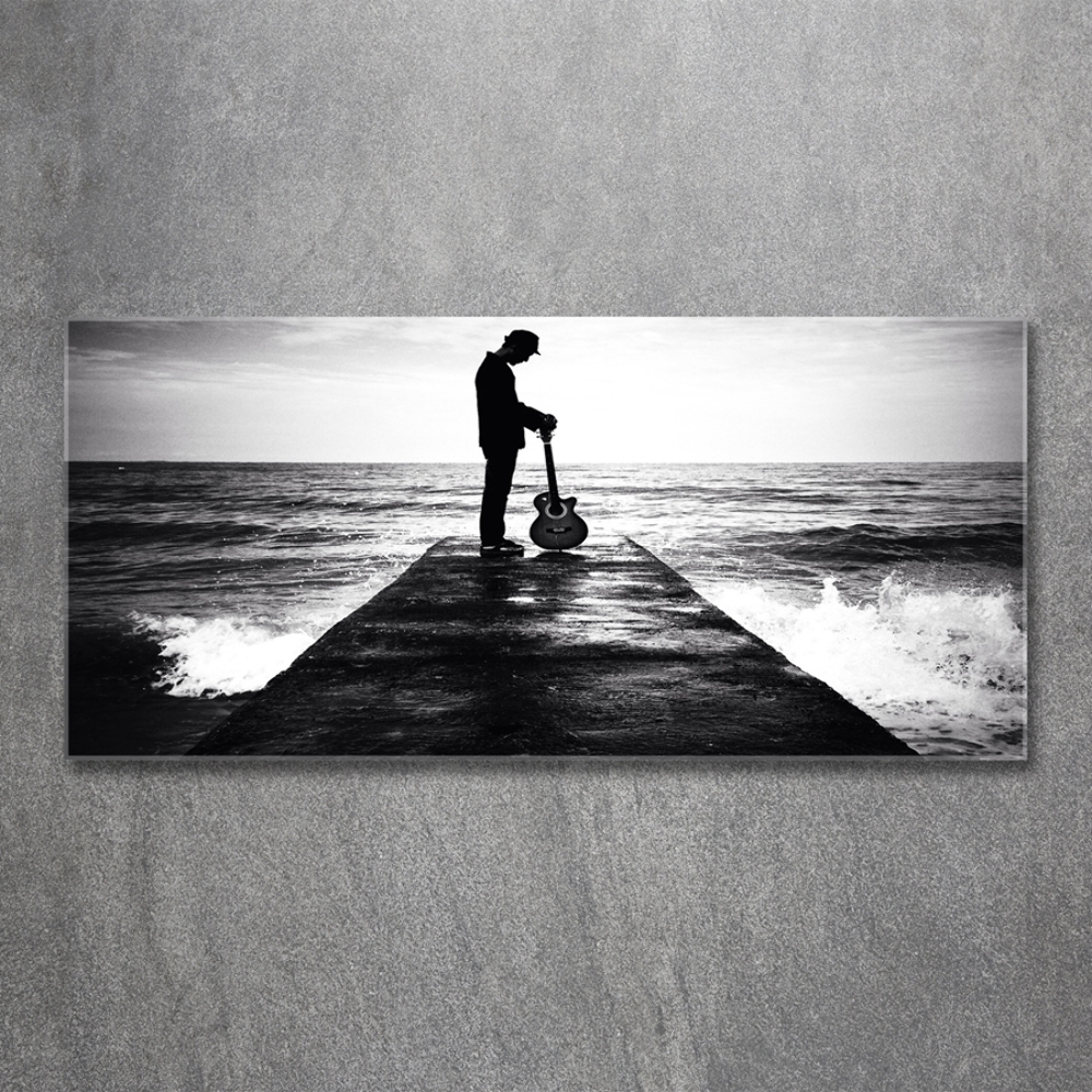 Photo printed on glass Guitarist on the pier