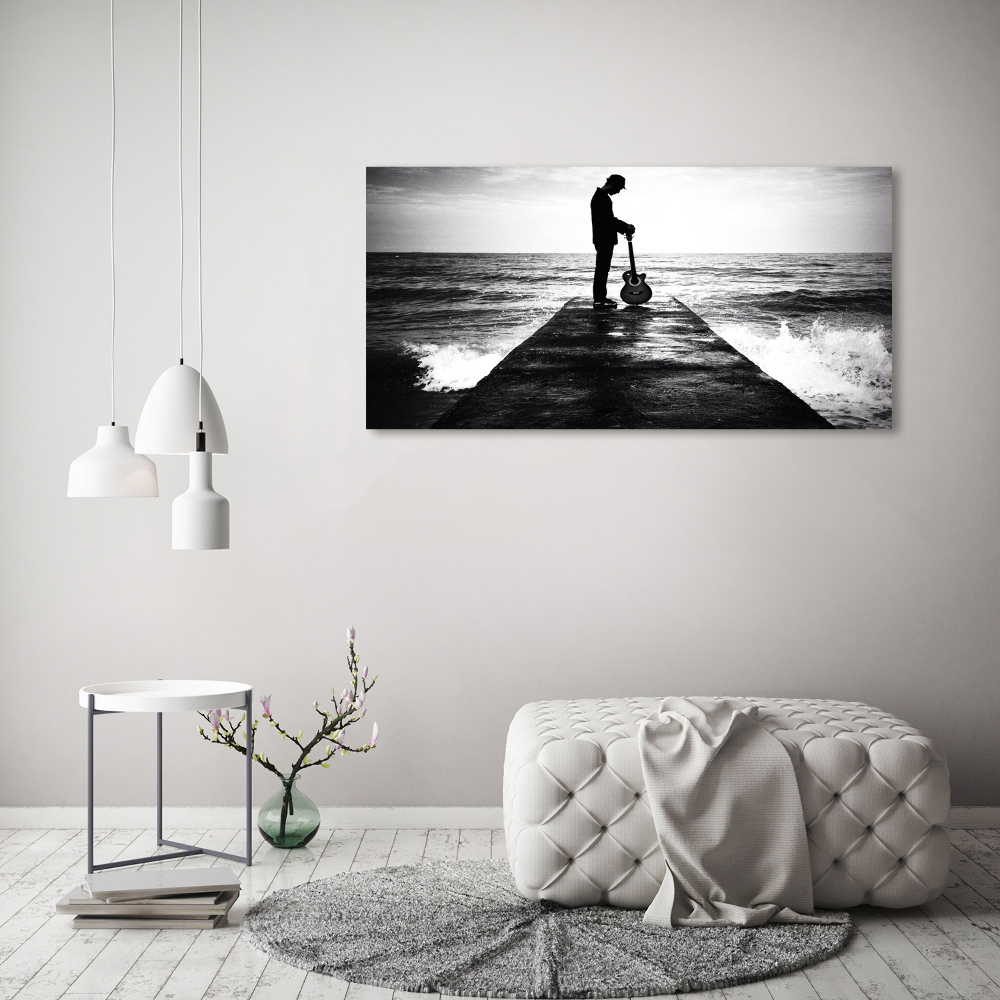 Photo printed on glass Guitarist on the pier