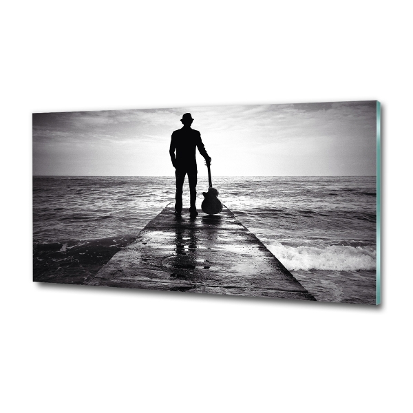 Photo printed on glass Guitarist on the pier