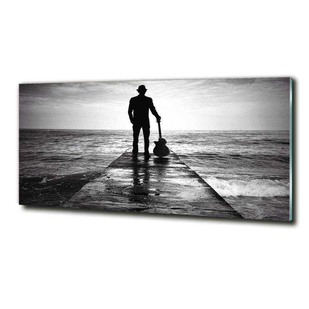 Photo printed on glass Guitarist on the pier