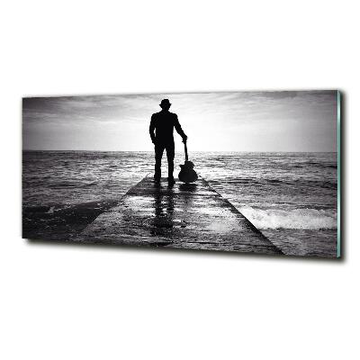 Photo printed on glass Guitarist on the pier