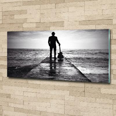 Photo printed on glass Guitarist on the pier