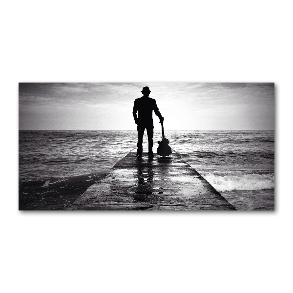 Photo printed on glass Guitarist on the pier